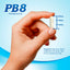 A PB8 Probiotic capsule is held in a hand, measuring 3/4 inch in length.