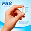 A hand holds a PB8 Probiotic capsule, measuring 3/4 inch long.