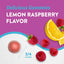 Lemon Raspberry magnesium gummy, 3/4 inches in size, next to fresh raspberries and lemon slices.