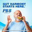 Middle-aged man eats a sandwich while making an 'okay' gesture, accompanied by PB8 Probiotic.