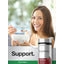 Young woman smiling while eating cereal with a Horbäach Cranberry supplement bottle beside her.