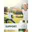 Mature couple practicing yoga outdoors in a park, next to a Carlyle Garlic & Cayenne bottle.