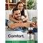 Young man and woman smiling on a couch, taking a selfie with a Burdock Root Liquid Extract bottle.