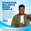 Young Black man smiling, giving a thumbs up, and holding his stomach with PB8 Probiotic in hand.