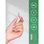 A light brown capsule is held between fingers, next to a measurement scale showing it is 1 inch long.