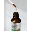 Horbäach Super Concentrated Burdock Root Liquid Extract 2 oz, with a dropper pouring liquid back into the bottle.