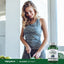 A young woman slices vegetables next to a bottle of Bilberry Extract.