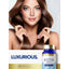 Lifestyle image of woman with long brown hair holding her hair, with Carlyle Biotin 1,000 mcg bottle and graphic stating LUXURIOUS.