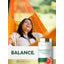 Lifestyle image of a smiling woman relaxing in an orange hammock with Grapefruit Seed Extract 500MG bottle and graphic stating BALANCE.