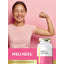 Lifestyle image of woman flexing her arm with Carlyle Multi for Women bottle and graphic stating WELLNESS