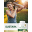 Woman smiling while exercising with a kettlebell, next to a Pea Protein Powder.