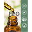 Dropper dispensing golden liquid into amber bottle with quality badges stating Finest Quality 100%, Ethically Sourced Ingredients, Packaged & Lab Tested USA