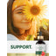 Lifestyle image of woman holding a sunflower with Liquid Grapefruit Seed Extract bottle nearby and graphic stating SUPPORT.