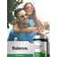Lifestyle image of smiling couple outdoors with Damiana Leaves bottle and graphic stating Balance.