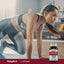 A young woman exercises on a mat beside a bottle of L-Histidine, promoting wellness and fitness.