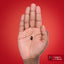 A single dark red Lycopene Quick Release Softgel on a hand, measuring 0.842 inches (2.139 cm).
