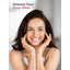 Young woman smiling and holding her face, with 'Unleash Your Inner Glow' text, for Keratin Hair Volumizer.