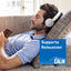 An adult man relaxes on a couch, listening to headphones next to NV Calm, enjoying a peaceful moment.
