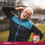 Lifestyle image of an older adult performing a neck stretch outdoors with a Lindberg d-Alpha Form (268 mg) E-400 IU