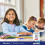 Lifestyle image of children doing schoolwork with Piping Rock Kids DHA + Vitamin D bottle nearby
