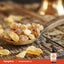 Frankincense resin pieces in a wooden spoon with a Piping Rock Frankincense Oil bottle in the corner