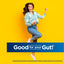 Young woman in a daisy cardigan smiles next to a banner with 'Good for your Gut!' text, conveying energetic positivity.