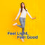 Young woman in white sweater and jeans smiling on a yellow background with 'Feel Light, Feel Good' text.