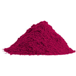 A vibrant magenta pile of organic beet root powder.