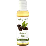 Jojoba Oil Simmondsia chinensis Pure Carrier Oil bottle, 4 FL. OZ. (118 mL), shown with jojoba seeds and leaves.